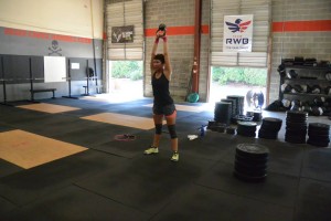 Kellie knocking out her kettlebell swings.