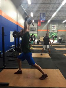 Justin drilling with the bar. Light technique practice brings PR's later.